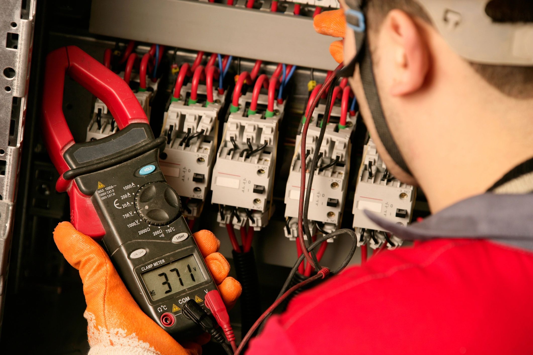 Electrician working on an electrical panel