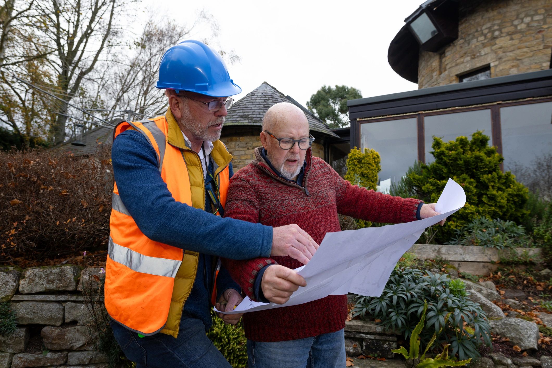 Client and contractor reviewing plans together