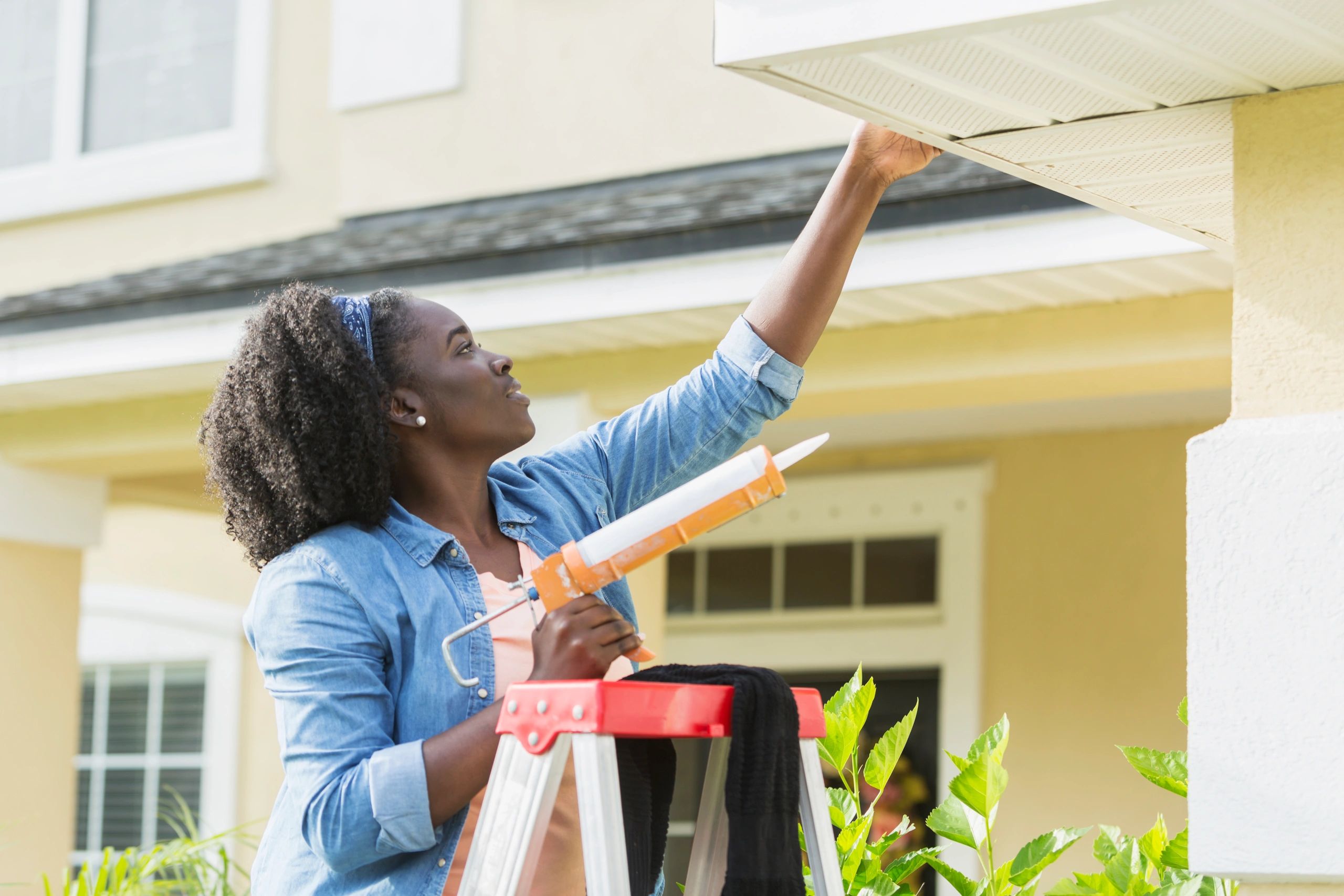 Maintenance professional performing exterior repair work